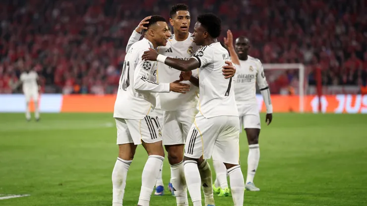 MUNICH, GERMANY - APRIL 15: Kylian Mbappe of Real Madrid celebrates scoring his team's third goal with teammates Jude Bellingham and Vinicius Junior during the UEFA Champions League 2025/26 Quarter-Final Second Leg match between FC Bayern München and Real Madrid CF at Football Arena Munich on April 15, 2026 in Munich, Germany. (Photo by Adam Pretty/Getty Images)