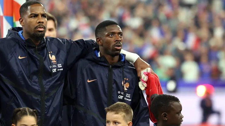 PARIS, FRANCE - OCTOBER 02: Ousmane Dembele and Mike Maignan of France look on during the national anthem before the UEFA Nations League 2026/27 group phase match between France and Italy at Stade de France on October 02, 2026 in Paris, France. (Photo by Pauline Figuet/Getty Images)