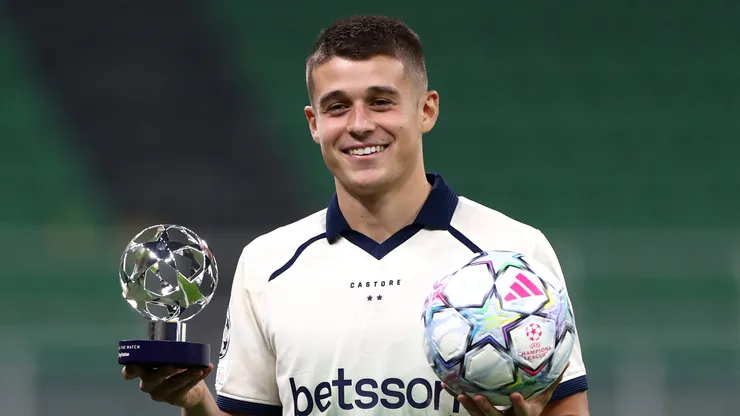 MILAN, ITALY - OCTOBER 13: Nicolo Tresoldi of Club Brugge KV poses for a photo with the PlayStation Player of the Match award and the match ball after scoring a hat-trick in the UEFA Champions League 2026/27 League Phase MD2 match between FC Internazionale Milano and Club Brugge KV at Stadio San Siro on October 13, 2026 in Milan, Italy. (Photo by Marco Luzzani/Getty Images)